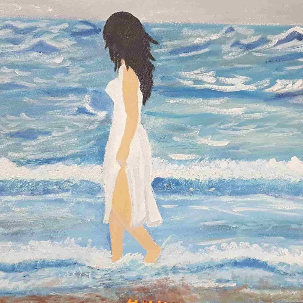 Woman Walking on Beach